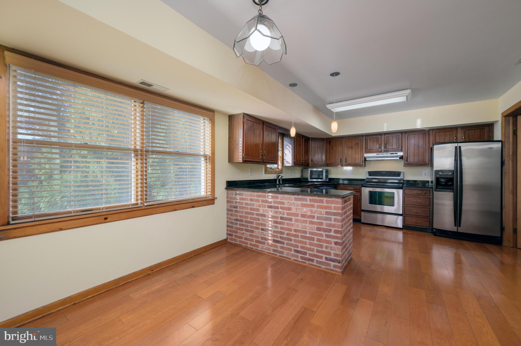 23 South Main Street, Unit 3 Medford, NJ 08055 - Photo 26 of 26 a kitchen with stainless steel appliances granite countertop a stove a sink and a refrigerator