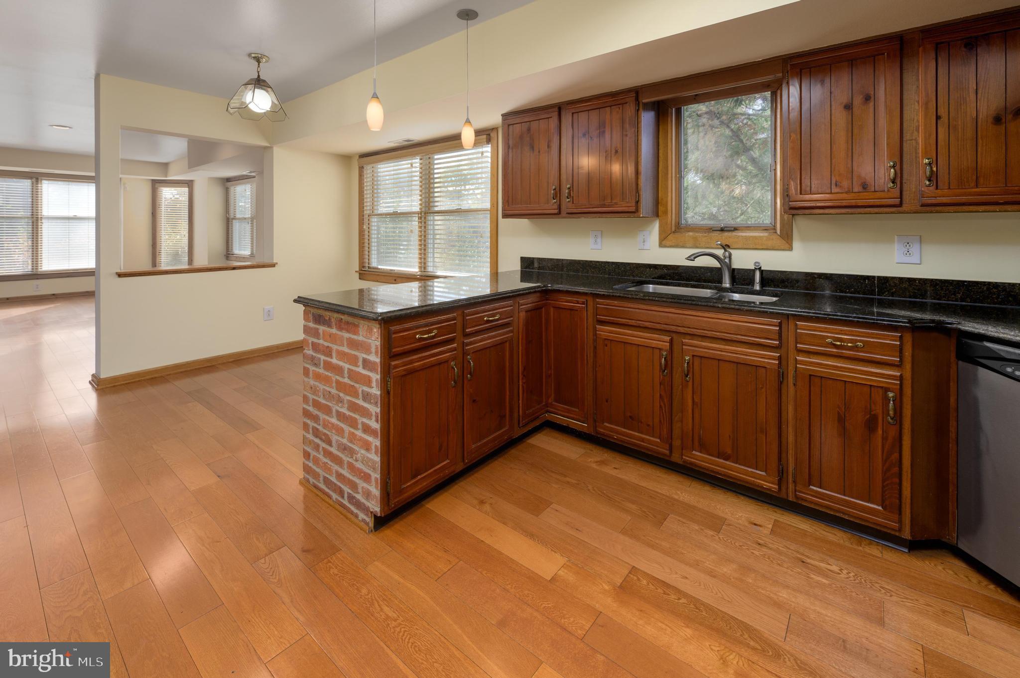 23 South Main Street, Unit 3 Medford, NJ 08055 - Photo 9 of 26 a kitchen with stainless steel appliances granite countertop a sink and cabinets
