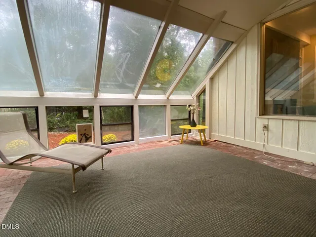 a room with furniture and a chandelier