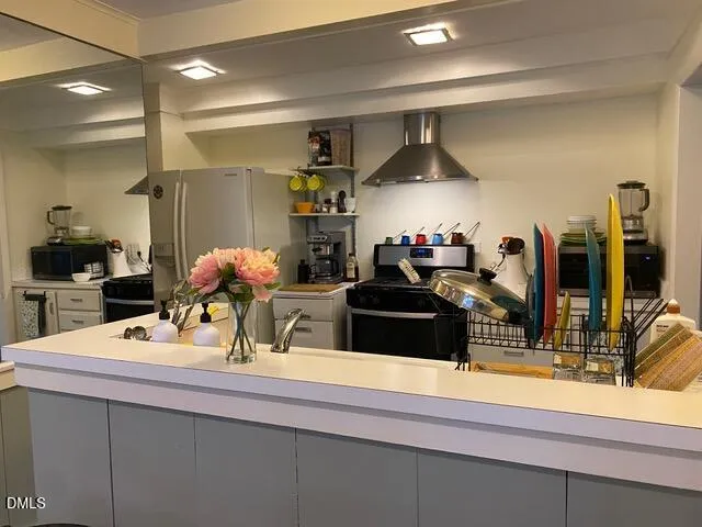 an empty room that has a grey walls