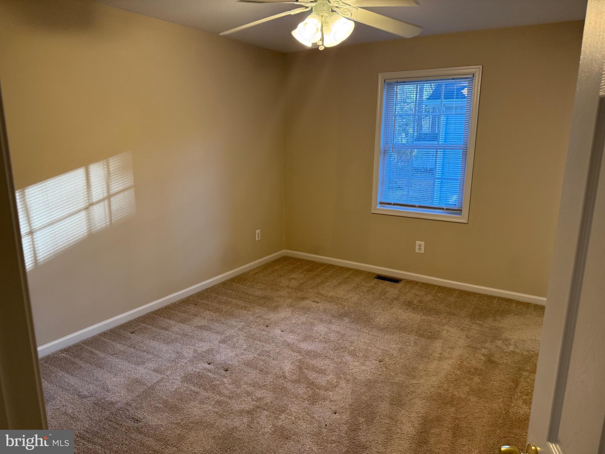 328 12th Street Colonial Beach, VA 22443 - Photo 12 of 19 an empty room with windows