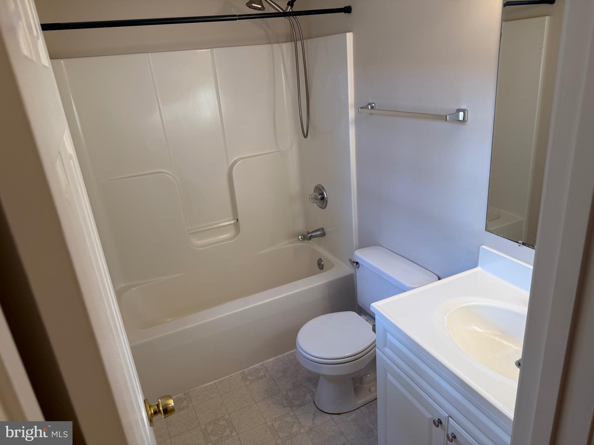 328 12th Street Colonial Beach, VA 22443 - Photo 14 of 19 a bathroom with a toilet and a shower