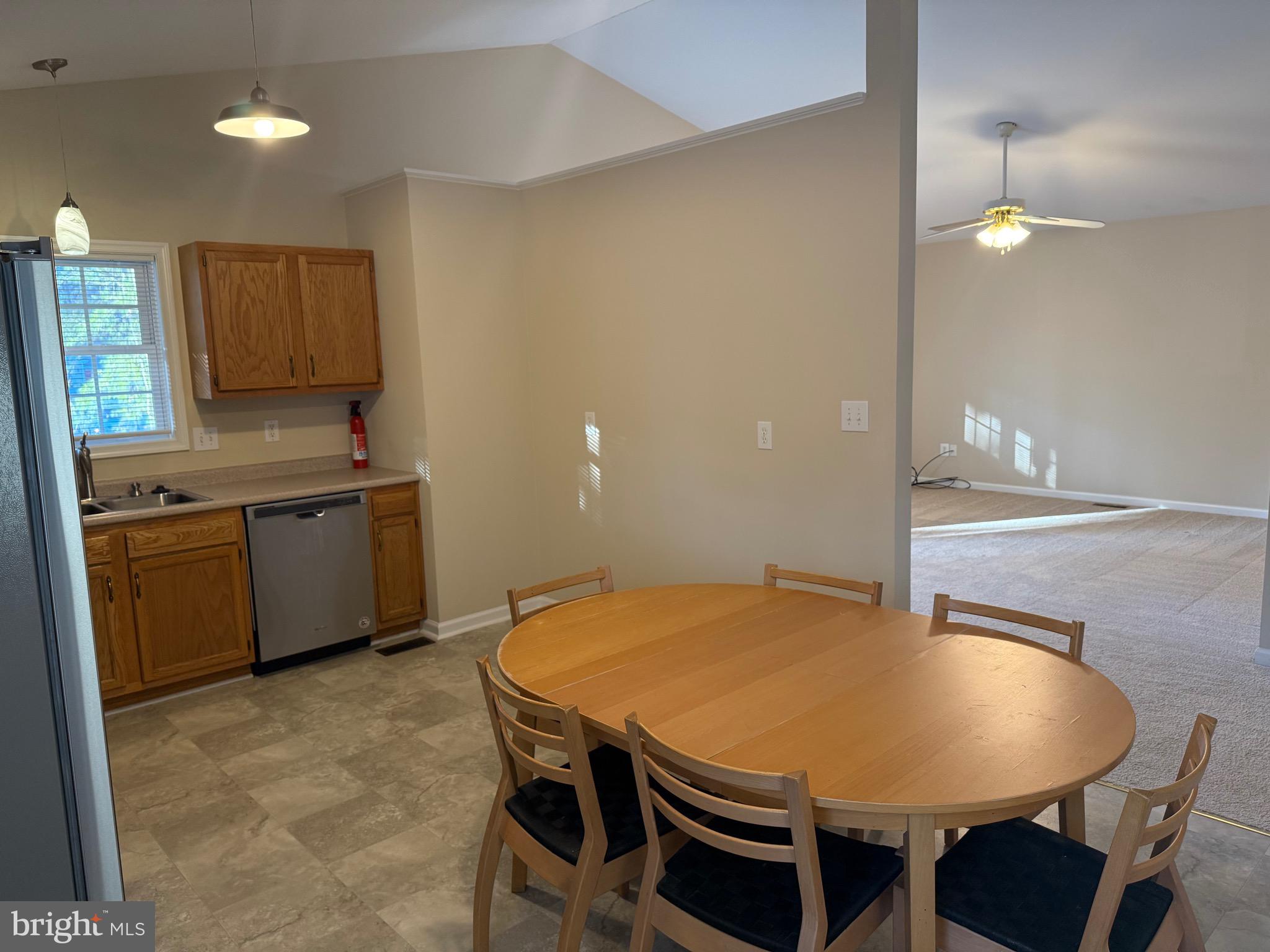 328 12th Street Colonial Beach, VA 22443 - Photo 6 of 19 a kitchen with a table and chairs in it