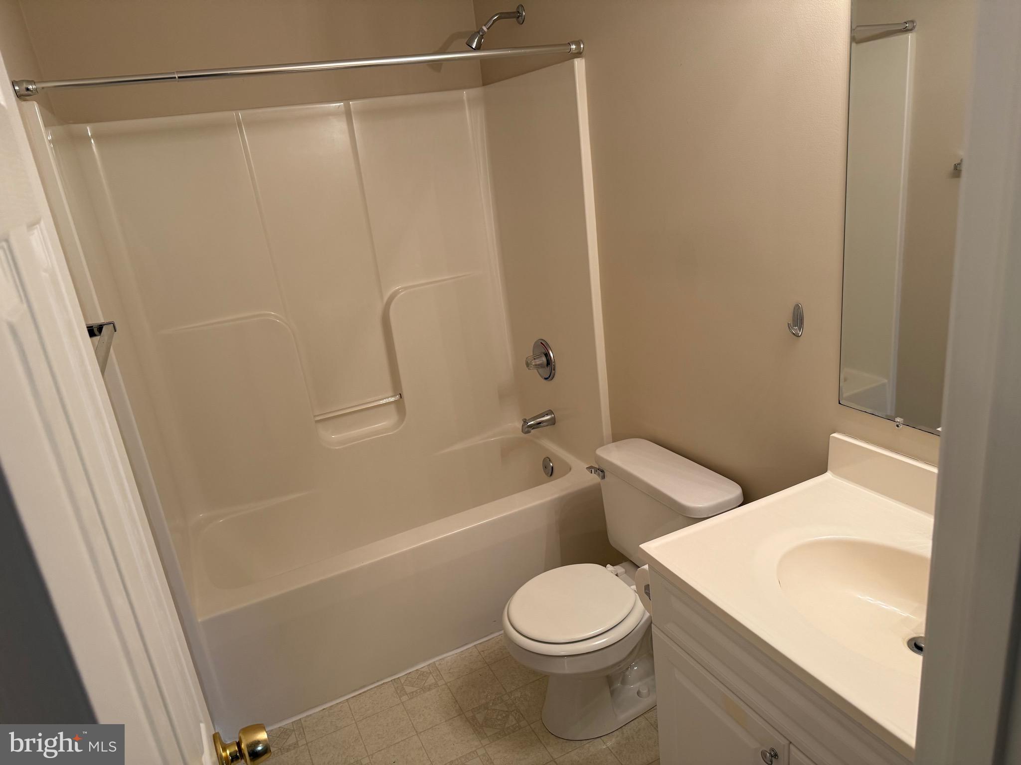 328 12th Street Colonial Beach, VA 22443 - Photo 9 of 19 a white toilet sitting next to a bath tub