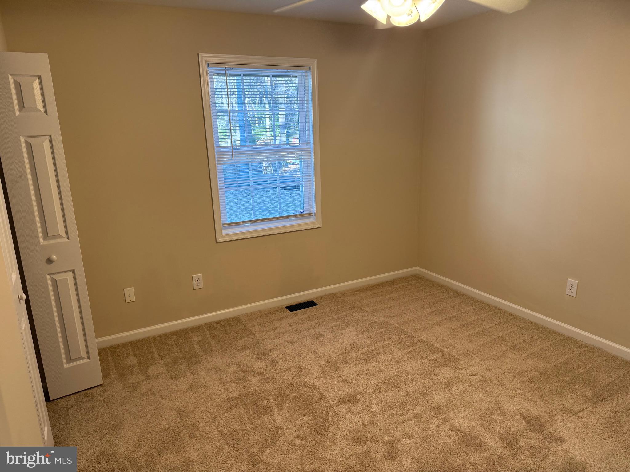 328 12th Street Colonial Beach, VA 22443 - Photo 10 of 19 an empty room with windows