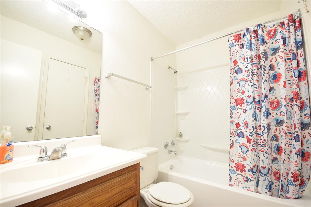 4909 Jamesway Road, Unit 203D Fort Worth, TX 76135 - Photo 17 of 17 a bathroom with a sink toilet and shower
