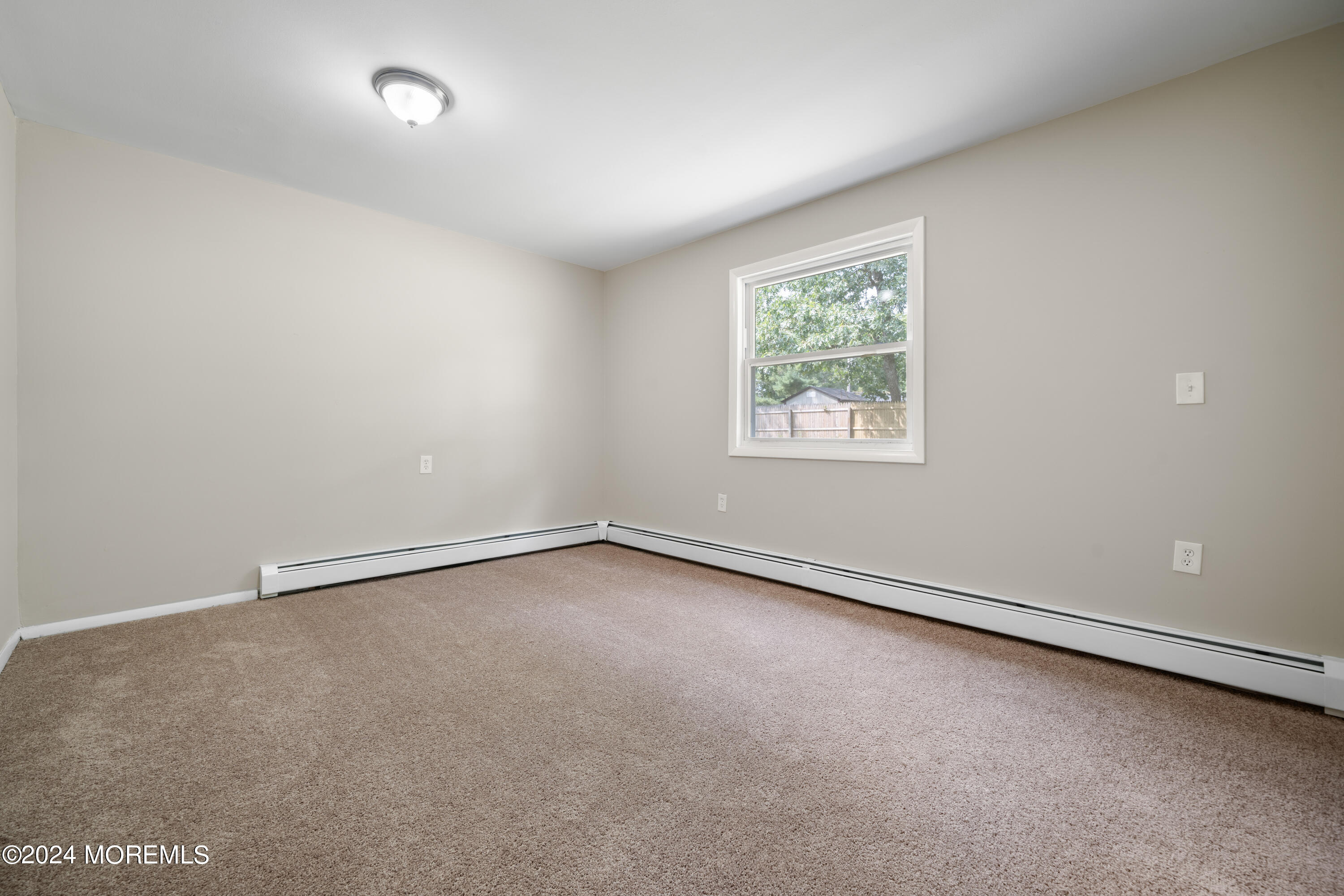 20 Willow Street Waretown, NJ 08758 - Photo 11 of 22 an empty room with a window