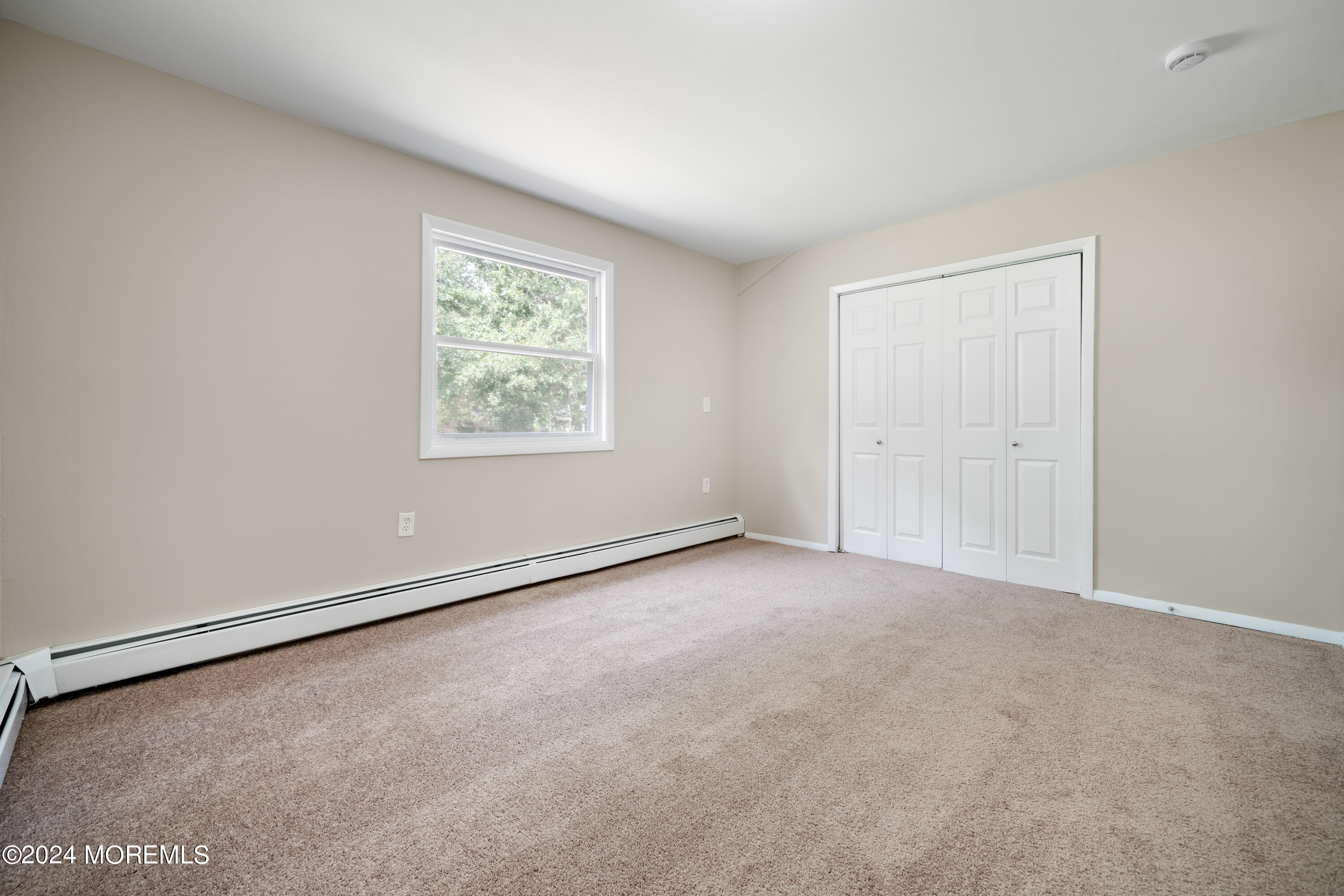 20 Willow Street Waretown, NJ 08758 - Photo 12 of 22 an empty room with a window
