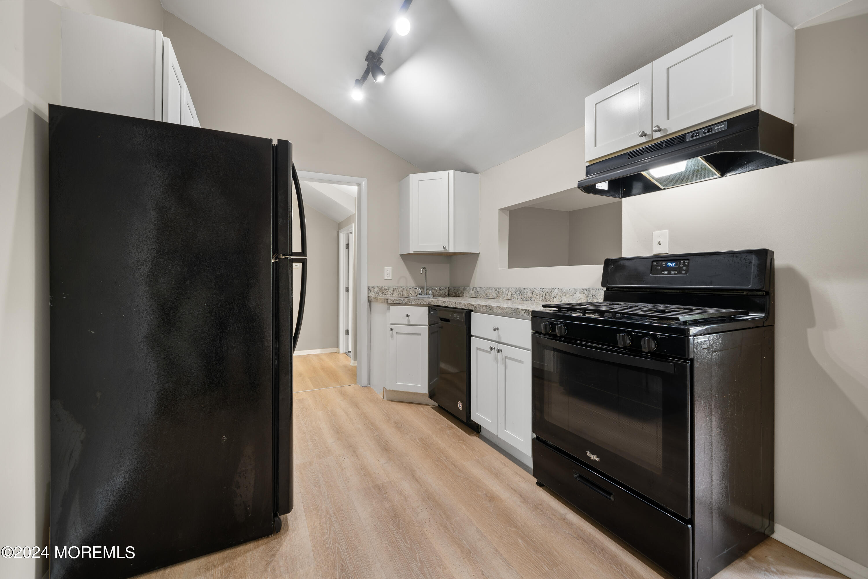 20 Willow Street Waretown, NJ 08758 - Photo 15 of 22 a kitchen with stainless steel appliances granite countertop a refrigerator and a stove