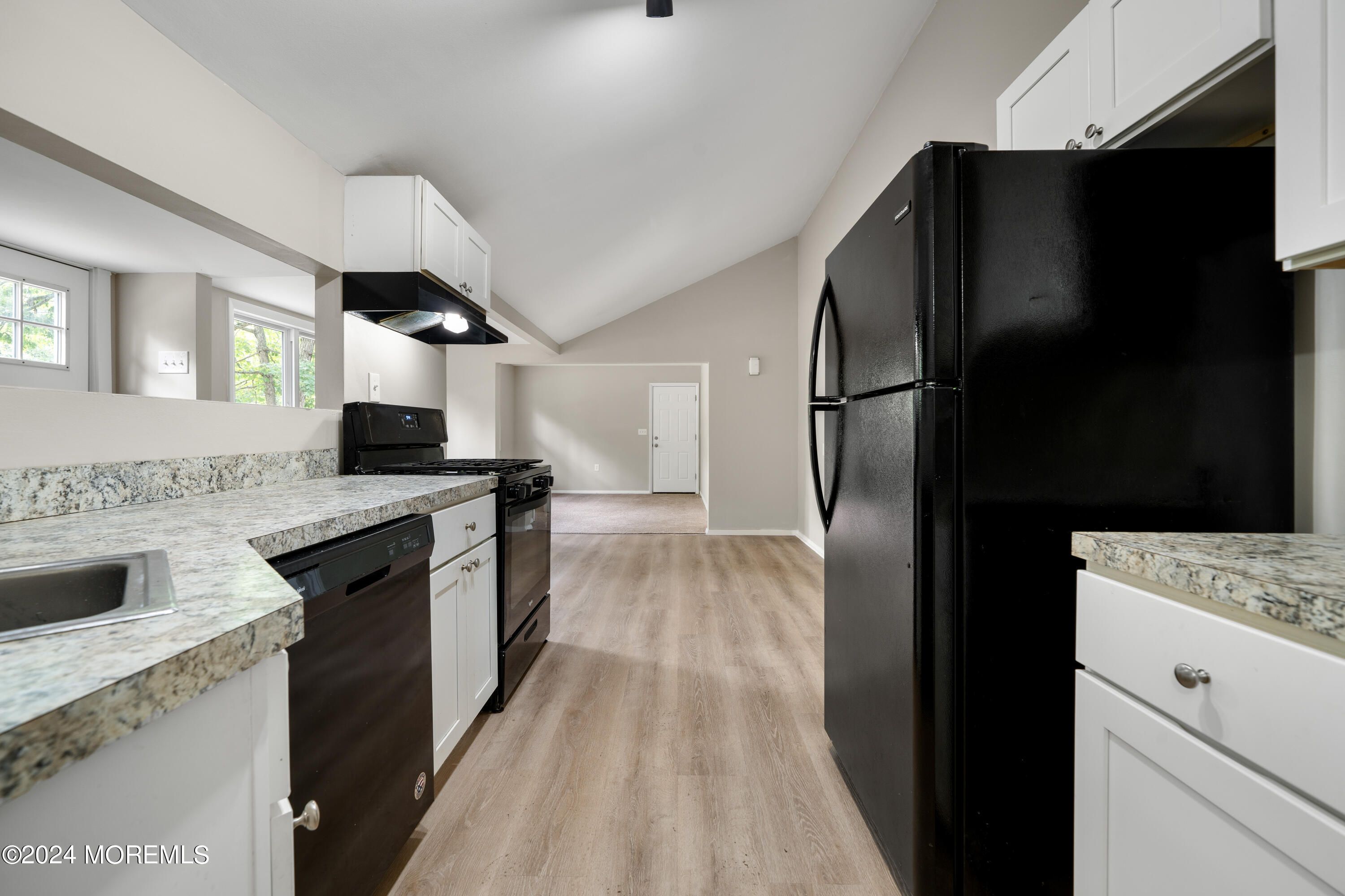 20 Willow Street Waretown, NJ 08758 - Photo 16 of 22 a kitchen with a refrigerator and a sink