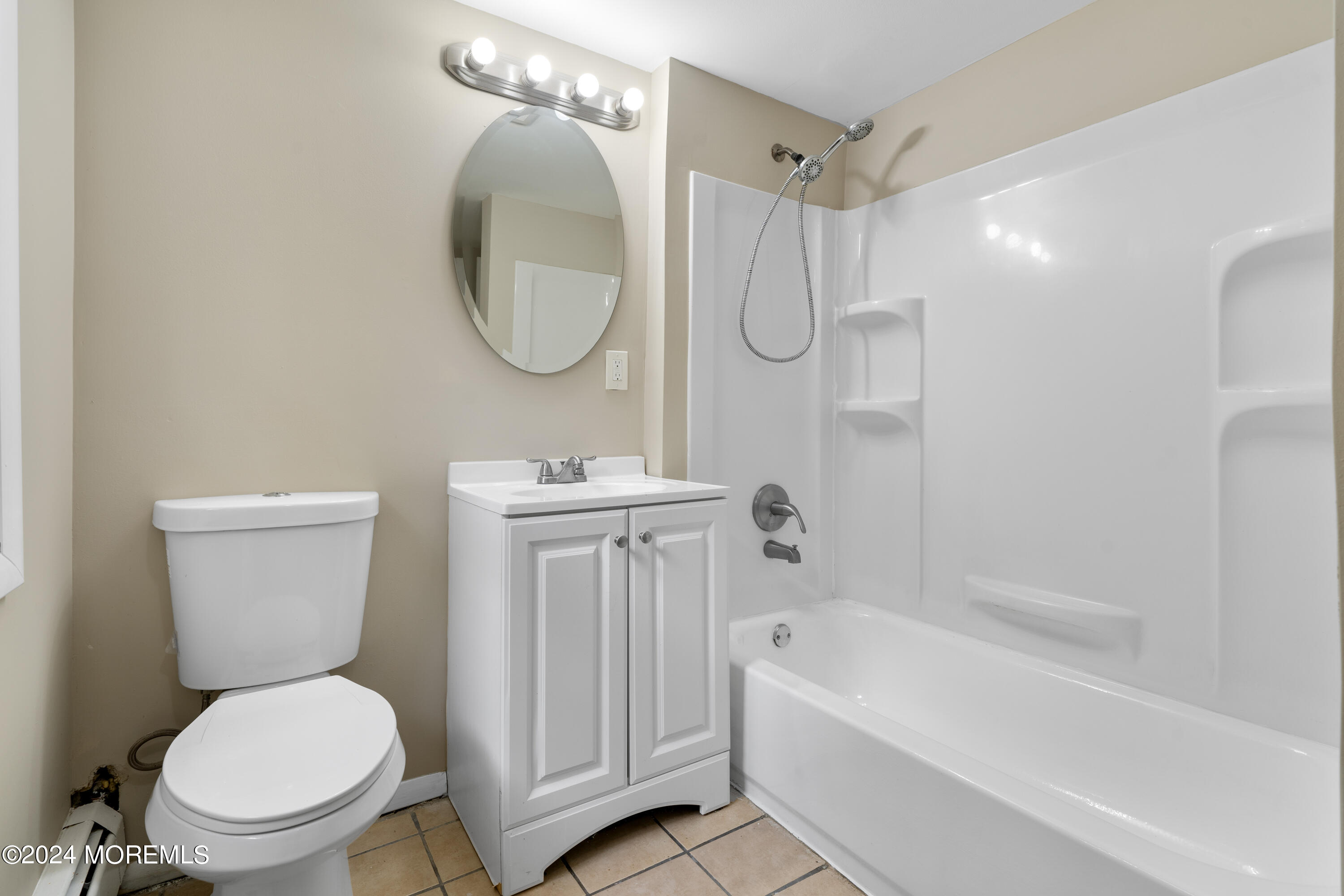 20 Willow Street Waretown, NJ 08758 - Photo 18 of 22 a bathroom with a toilet sink and a mirror