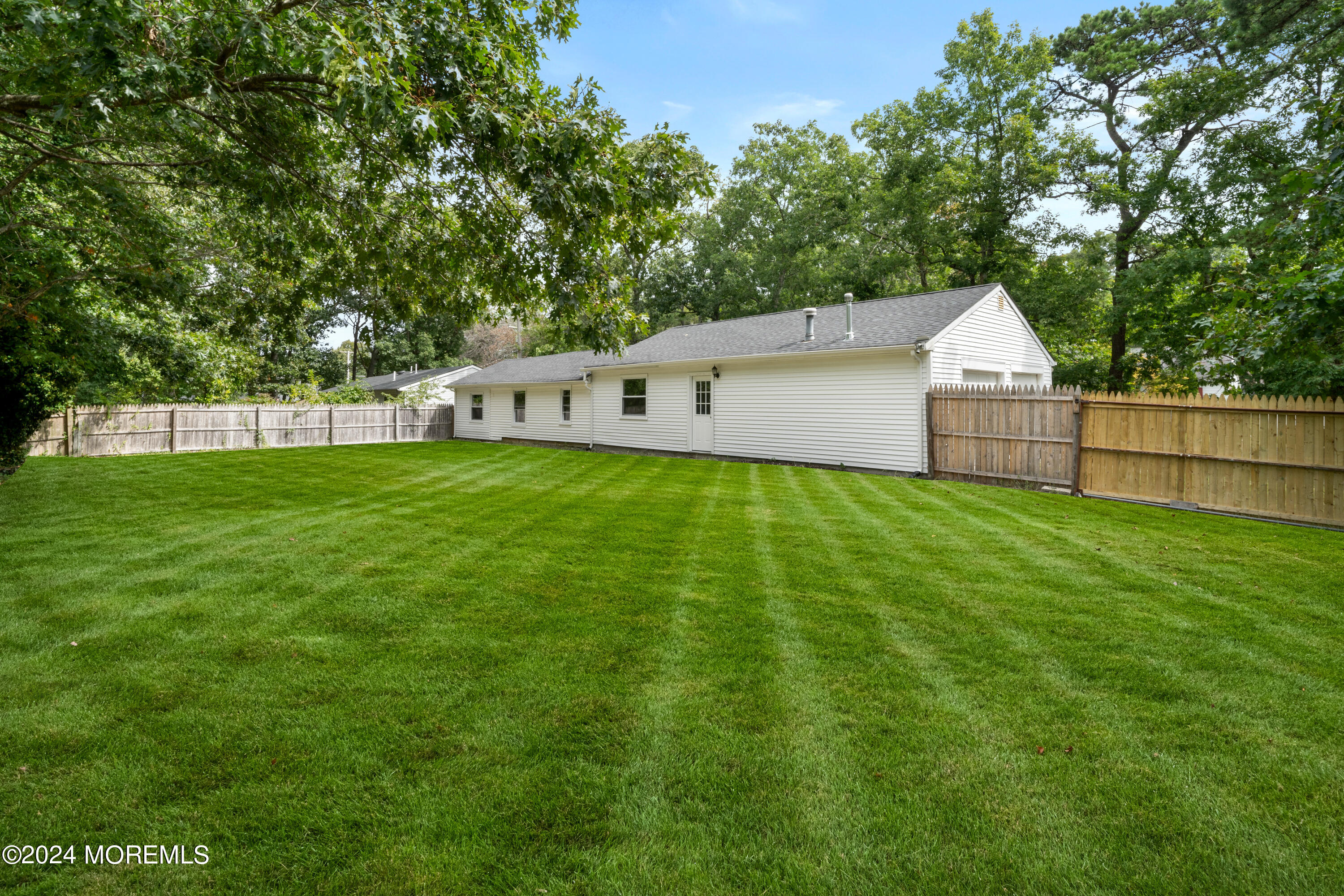 20 Willow Street Waretown, NJ 08758 - Photo 20 of 22 a front view of a house with a yard and trees
