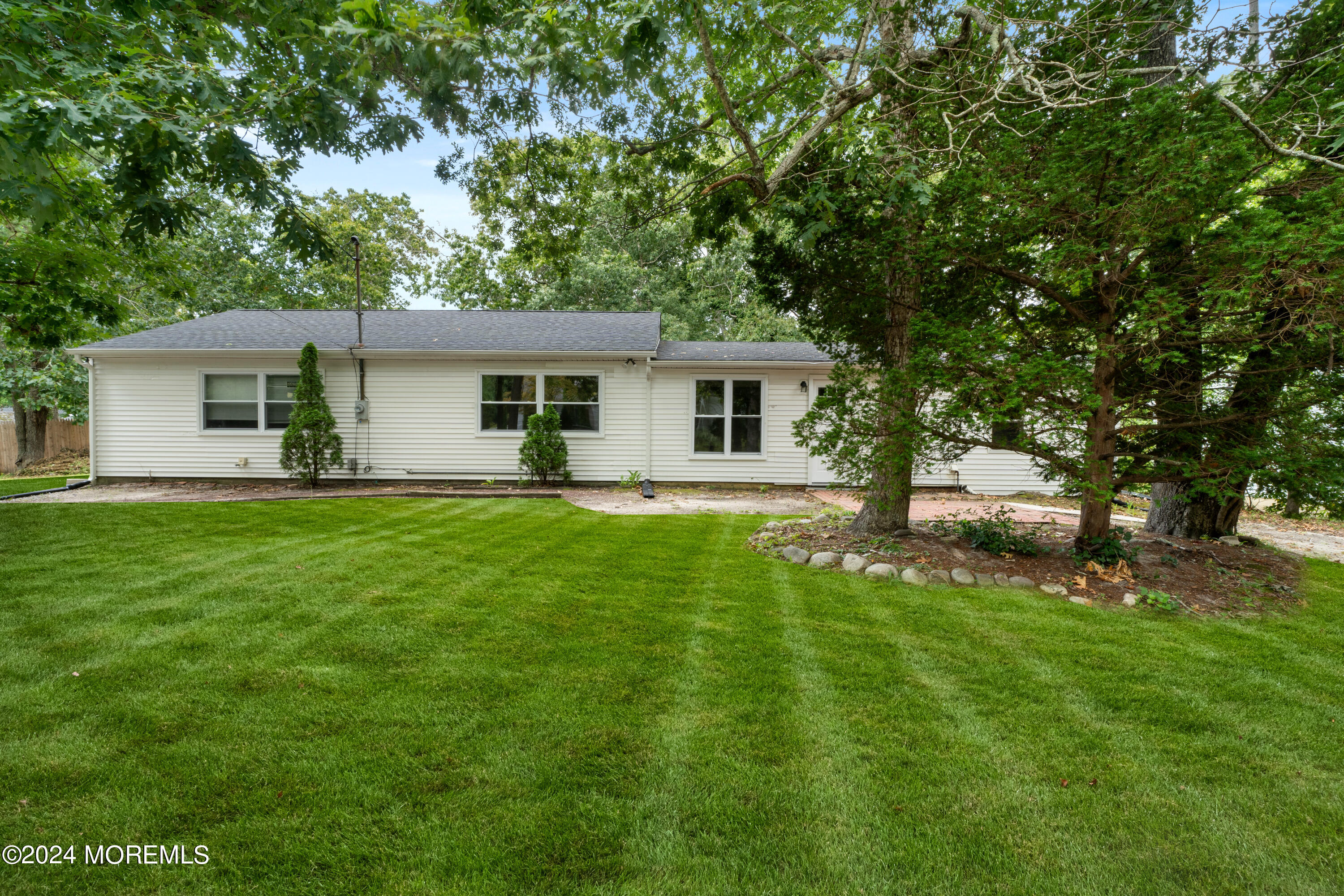 20 Willow Street Waretown, NJ 08758 - Photo 2 of 22 a front view of house with yard and green space