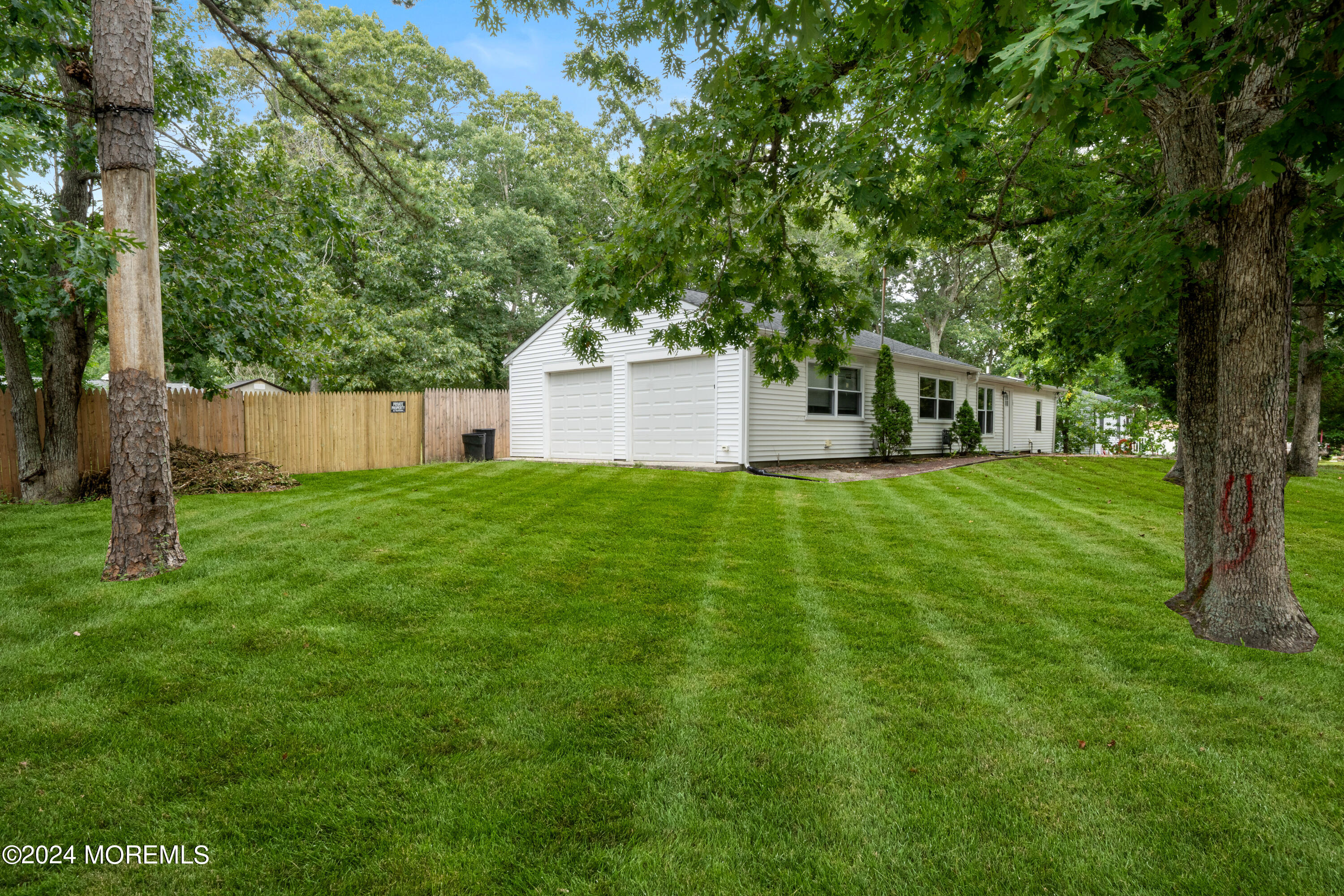 20 Willow Street Waretown, NJ 08758 - Photo 3 of 22 a view of a house with a big yard and large trees