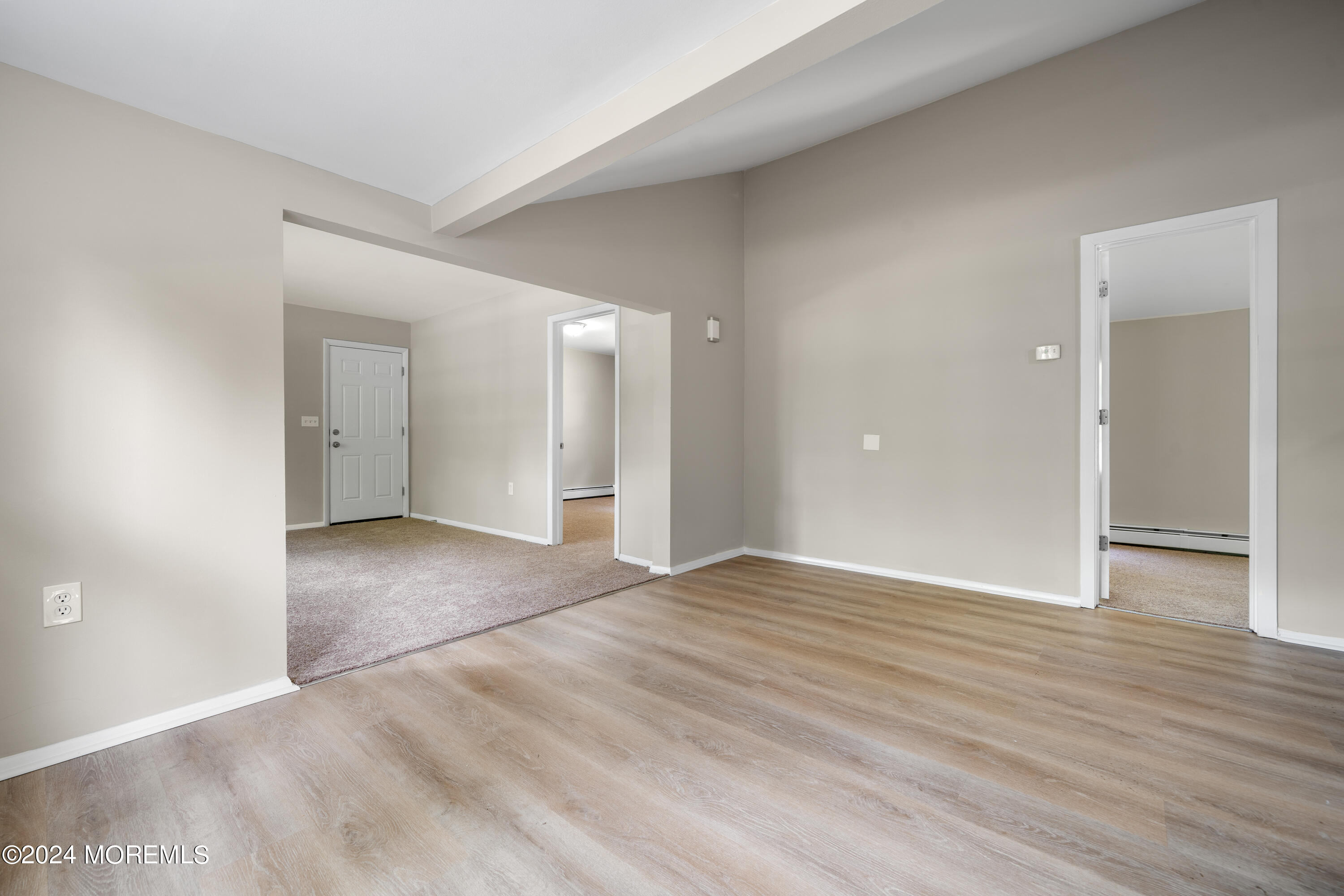20 Willow Street Waretown, NJ 08758 - Photo 6 of 22 a view of an empty room with wooden floor