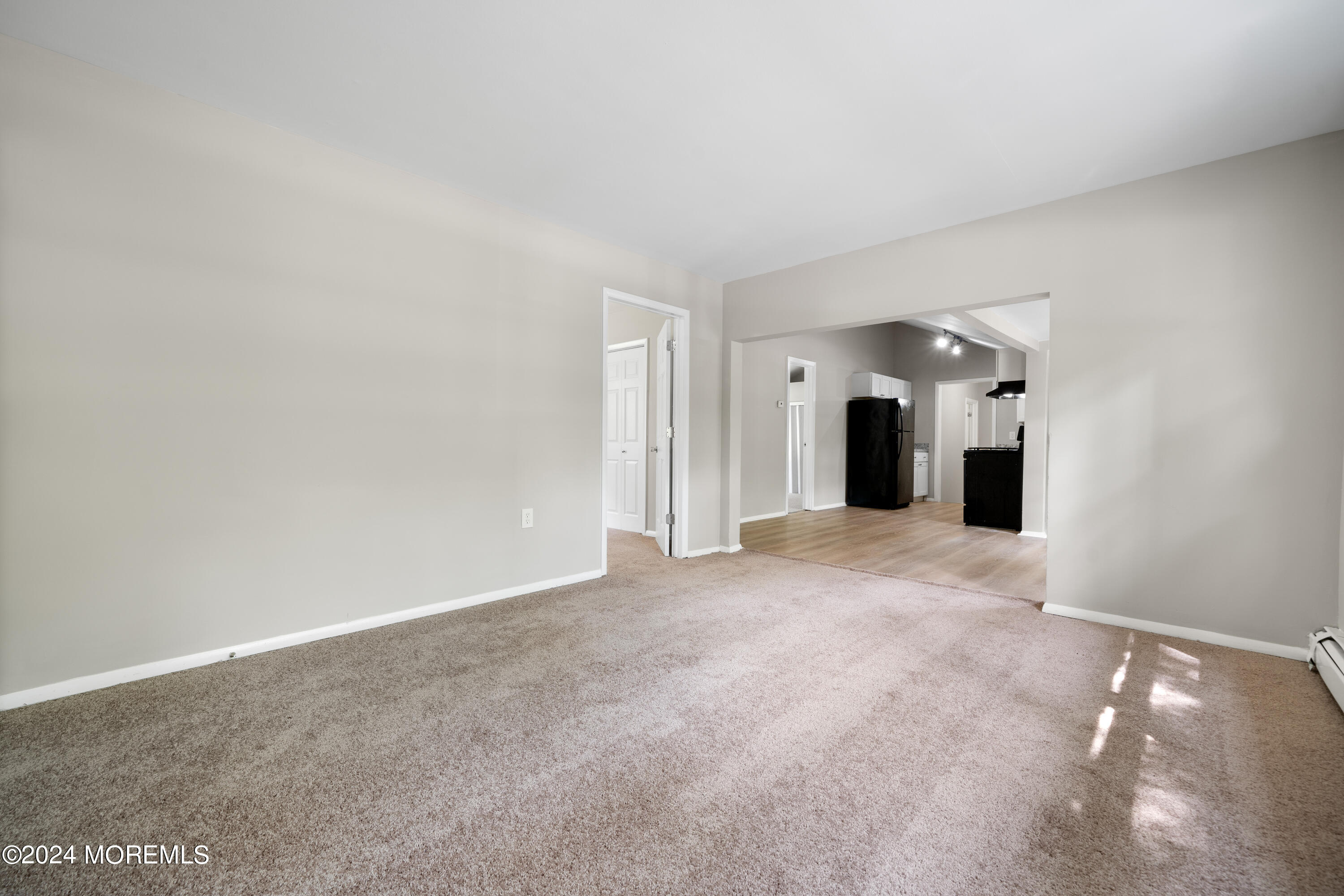 20 Willow Street Waretown, NJ 08758 - Photo 10 of 22 a view of a big room with a refrigerator and cabinet