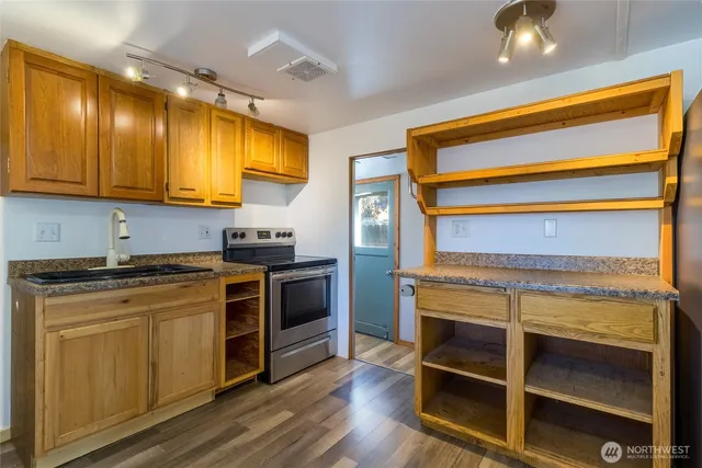 a kitchen with a stove and a microwave