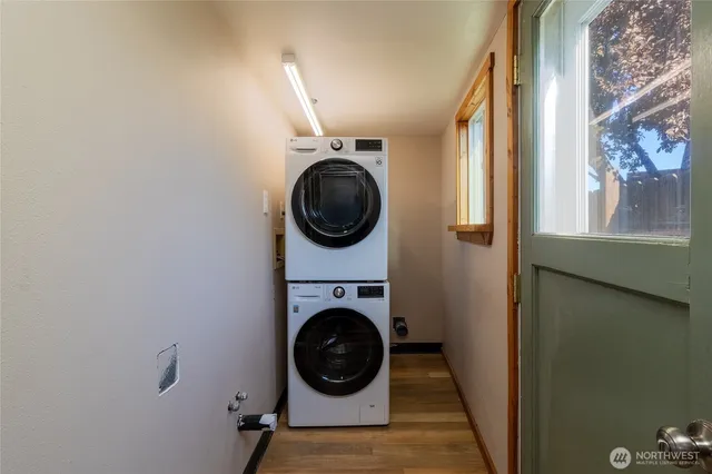 a view of a hallway with washer and dryer