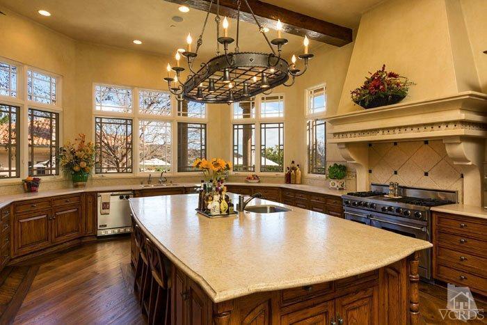 2300 White Stallion Road Thousand Oaks, CA 91361 - Photo 23 of 86 a kitchen with stainless steel appliances granite countertop a stove a sink dishwasher and cabinets with wooden floor
