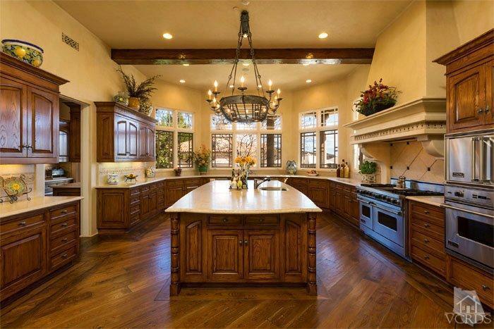 2300 White Stallion Road Thousand Oaks, CA 91361 - Photo 25 of 86 a kitchen with stainless steel appliances kitchen island granite countertop a stove a sink dishwasher and a refrigerator with wooden floor