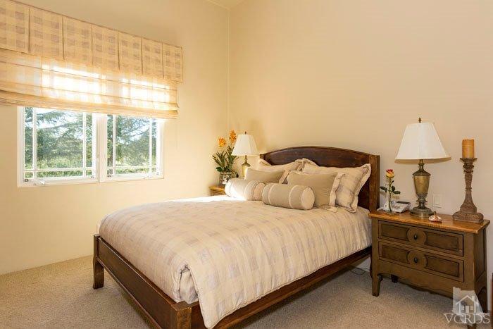 2300 White Stallion Road Thousand Oaks, CA 91361 - Photo 38 of 86 a bedroom with a bed and large windows