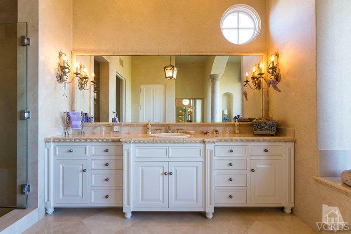 2300 White Stallion Road Thousand Oaks, CA 91361 - Photo 44 of 86 a bathroom with a granite countertop sink a large mirror and a vanity