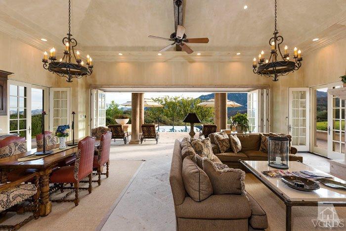 2300 White Stallion Road Thousand Oaks, CA 91361 - Photo 71 of 86 a living room with patio furniture and a chandelier