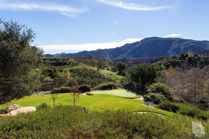 2300 White Stallion Road Thousand Oaks, CA 91361 - Photo 77 of 86 a view of a lush green hillside and a houses