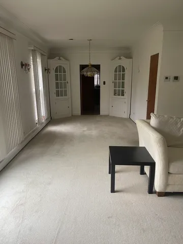 a view of workspace with furniture and window