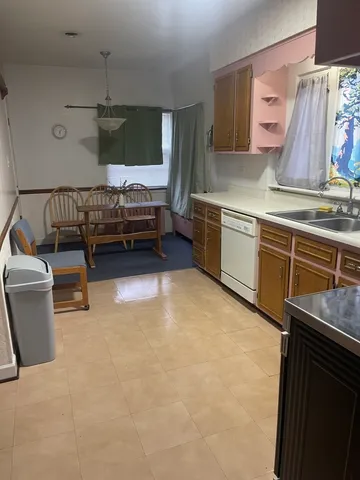 a kitchen with stainless steel appliances granite countertop a sink and cabinets