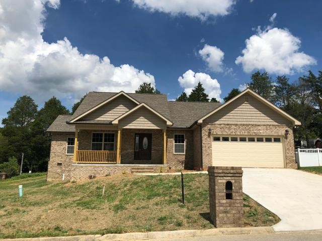 125 Timber Creek Road Maynardville, TN 37807 - Photo 3 of 18 a front view of a house with garden