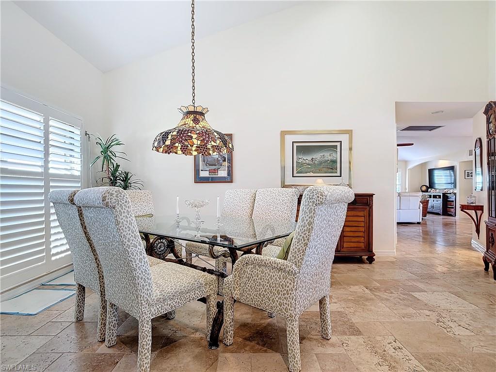 1659 Sandpiper Street, Unit E Naples, FL 34112 - Photo 11 of 50 a view of a dining room with furniture