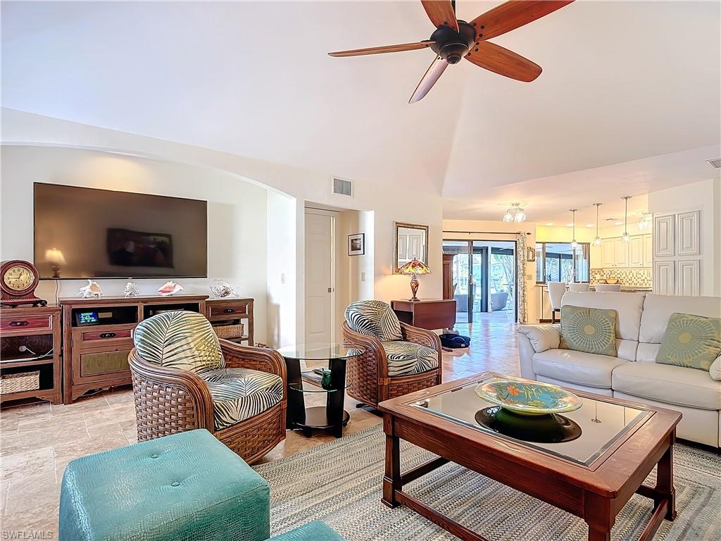 1659 Sandpiper Street, Unit E Naples, FL 34112 - Photo 13 of 50 a living room with furniture and a flat screen tv