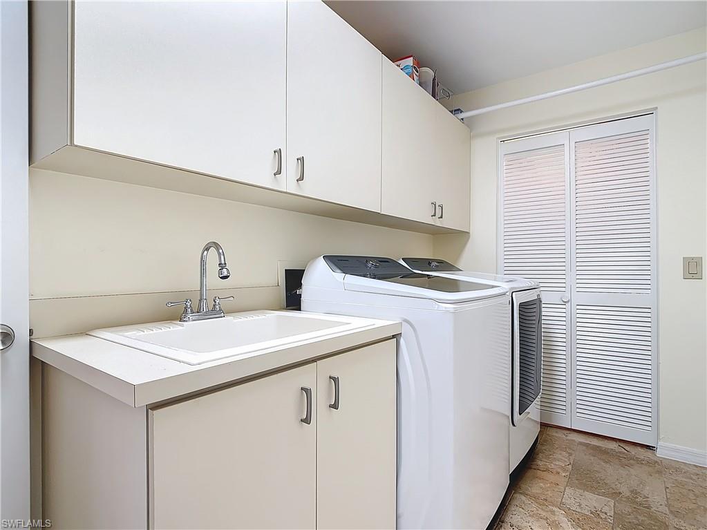 1659 Sandpiper Street, Unit E Naples, FL 34112 - Photo 35 of 50 a utility room with dryer and washer