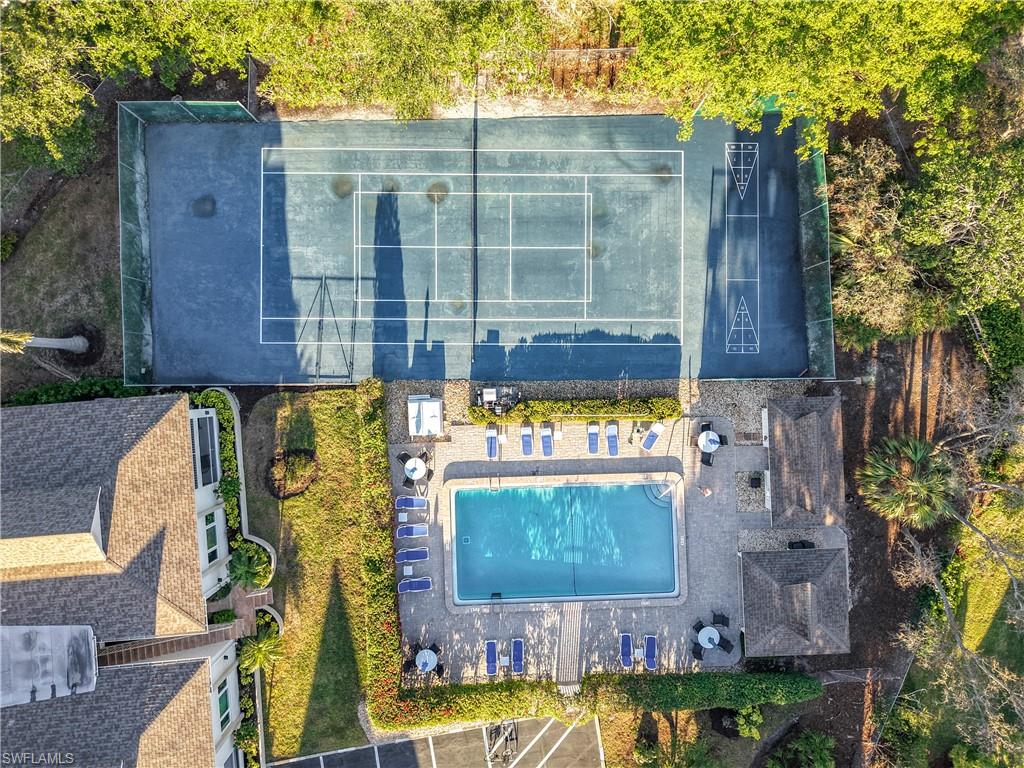 1659 Sandpiper Street, Unit E Naples, FL 34112 - Photo 47 of 50 a view of a street with wooden fence