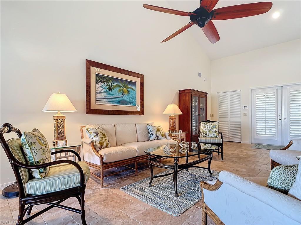 1659 Sandpiper Street, Unit E Naples, FL 34112 - Photo 9 of 50 a living room with furniture and a window
