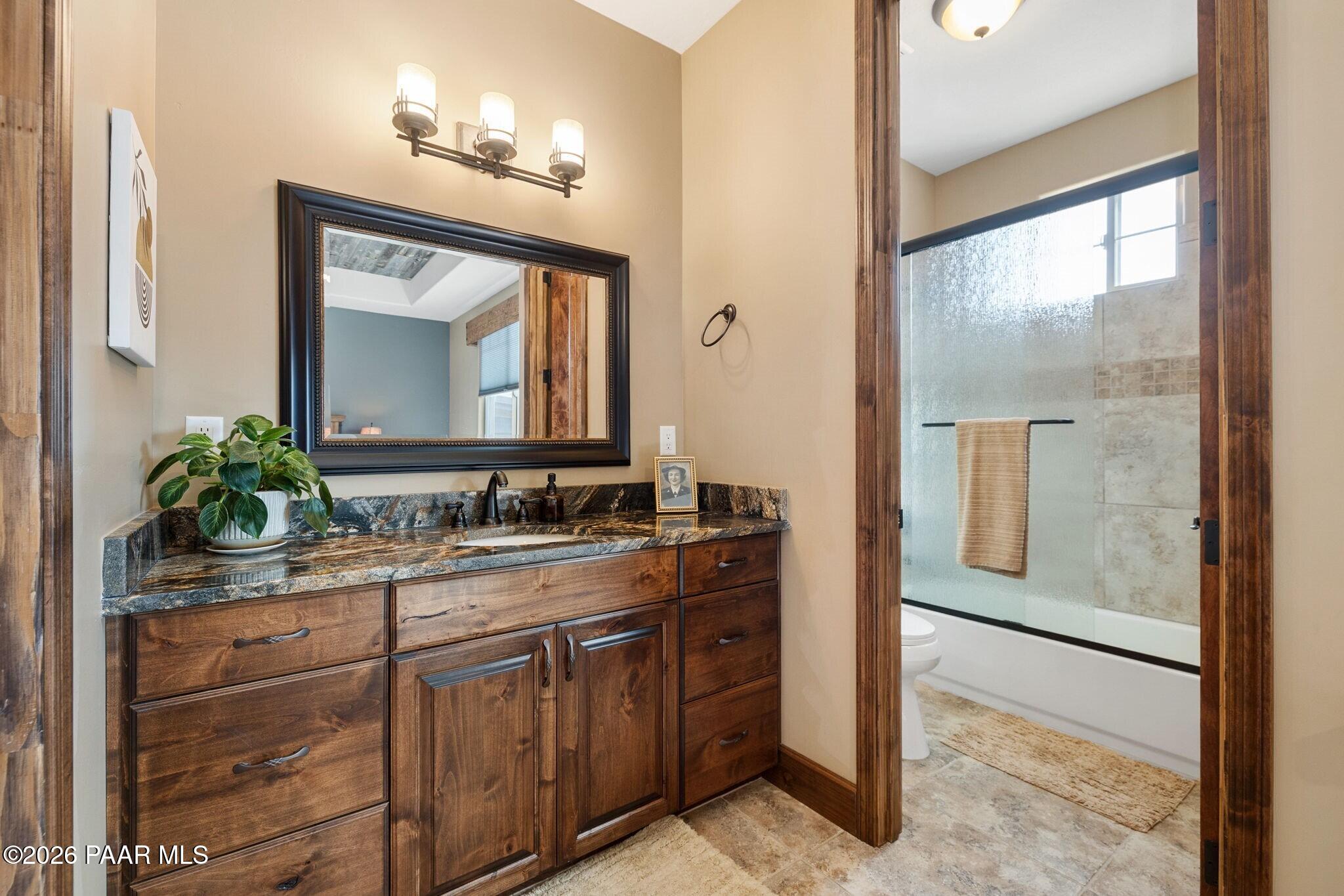 4290 Fort Bridger Road Prescott, AZ 86305 - Photo 23 of 50 a bathroom with a double vanity sink and mirror