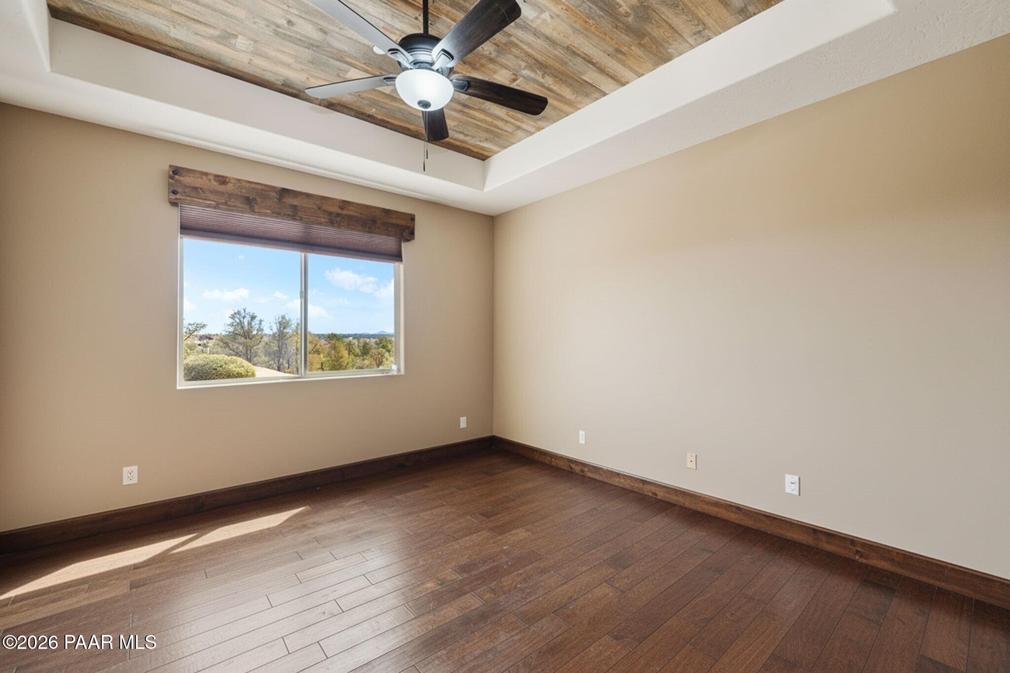 4290 Fort Bridger Road Prescott, AZ 86305 - Photo 27 of 50 an empty room with wooden floor and windows