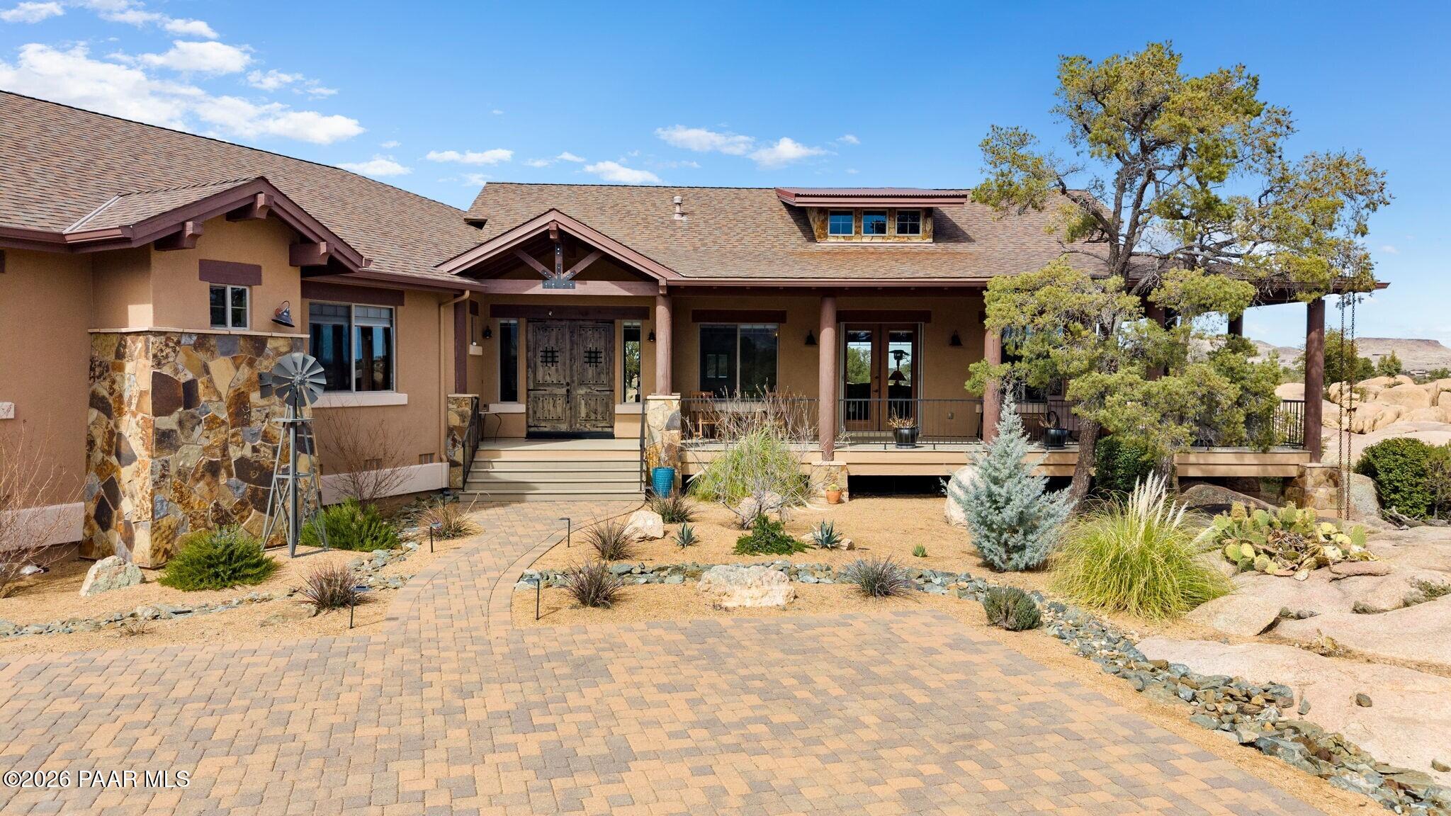 4290 Fort Bridger Road Prescott, AZ 86305 - Photo 3 of 50 a front view of a house with a yard and garage