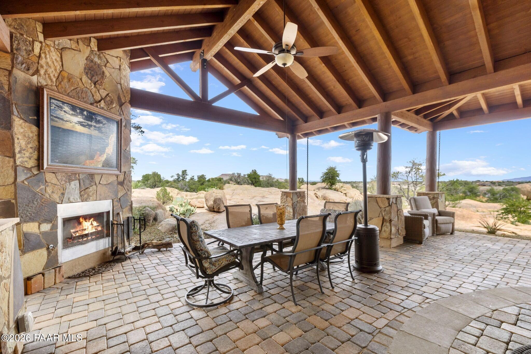 4290 Fort Bridger Road Prescott, AZ 86305 - Photo 34 of 50 a view of a patio with a dining table and chairs