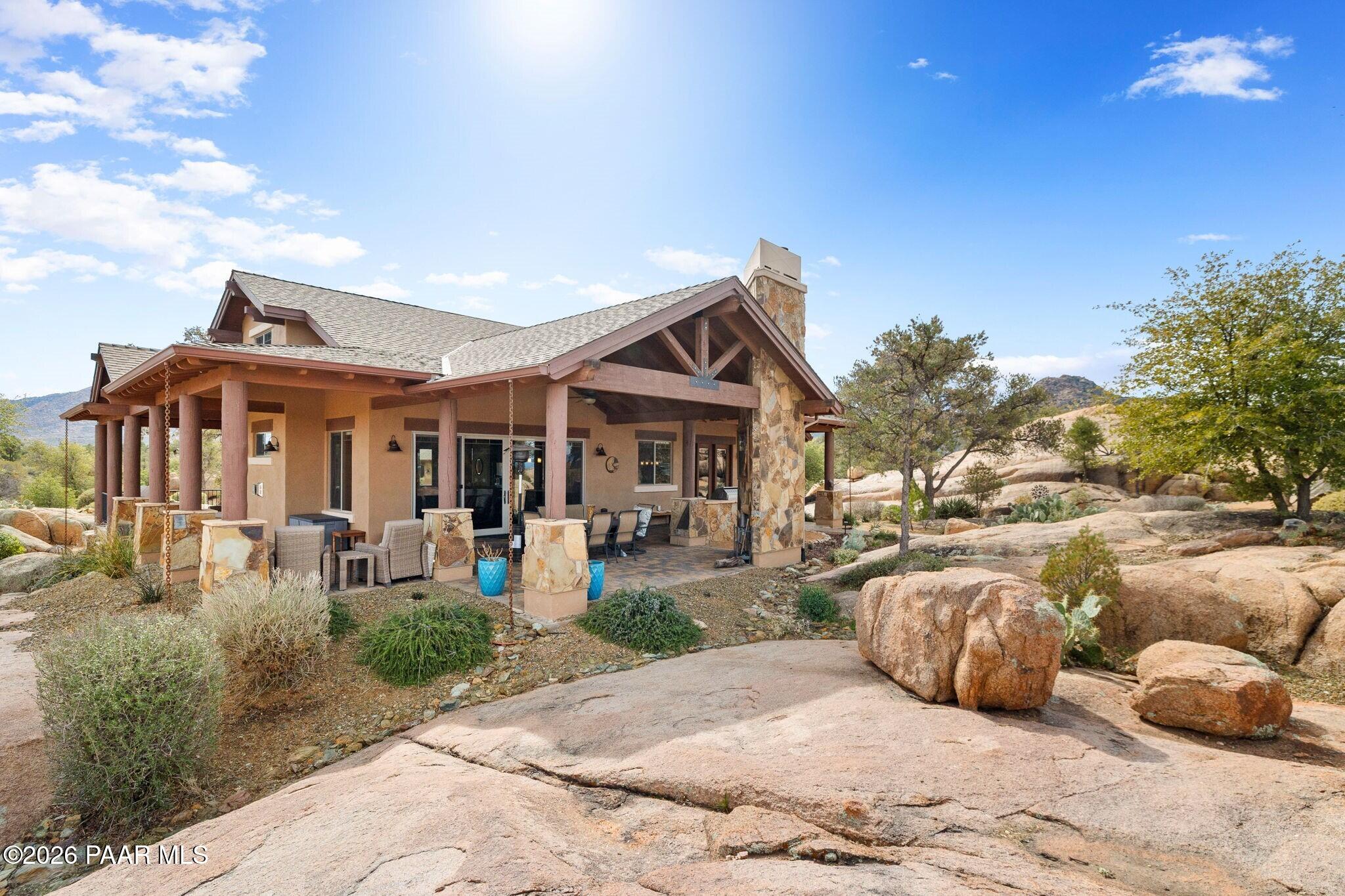 4290 Fort Bridger Road Prescott, AZ 86305 - Photo 37 of 50 a front view of a house with garden and porch