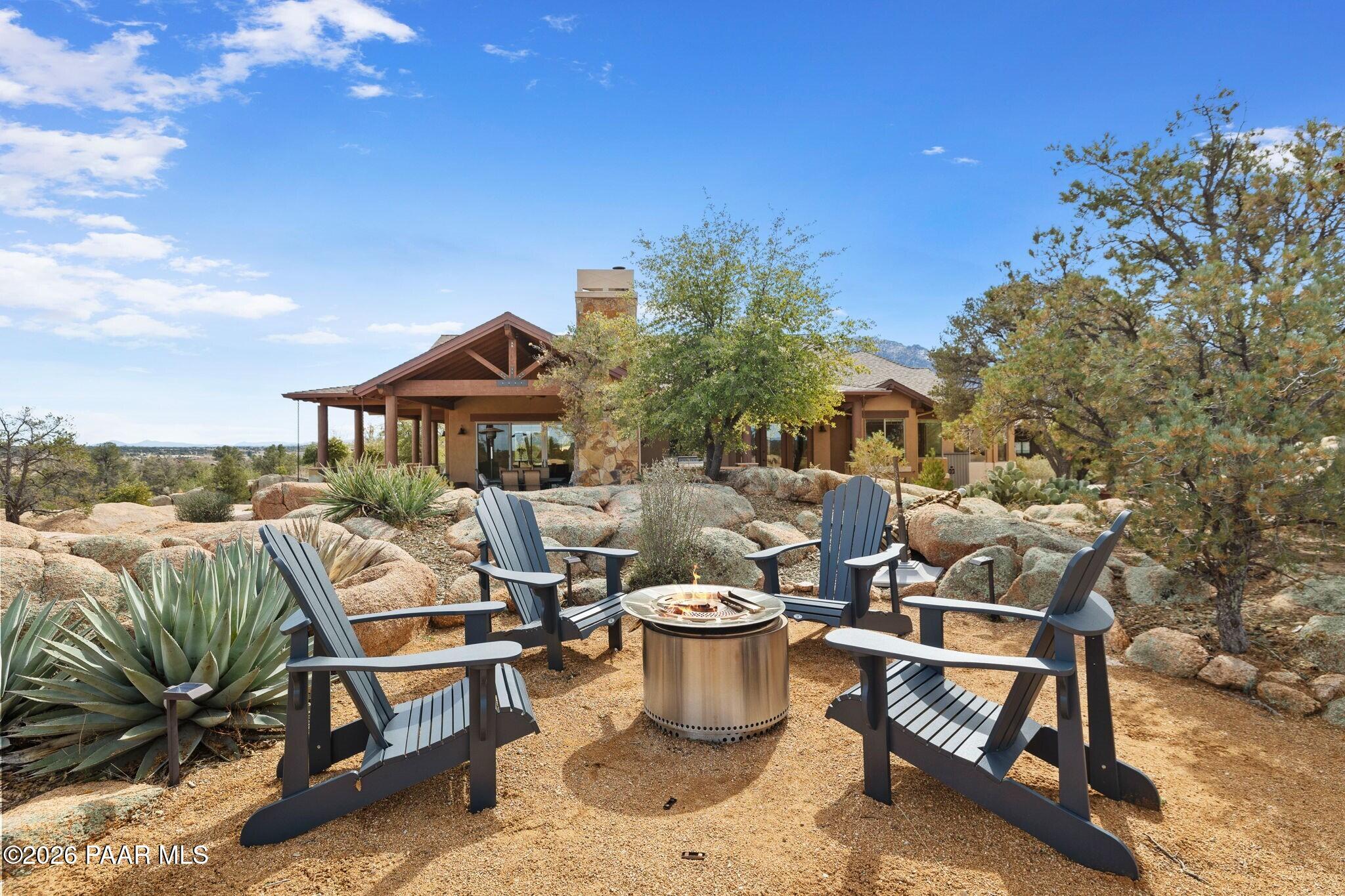4290 Fort Bridger Road Prescott, AZ 86305 - Photo 40 of 50 a view of a patio with chairs and tables