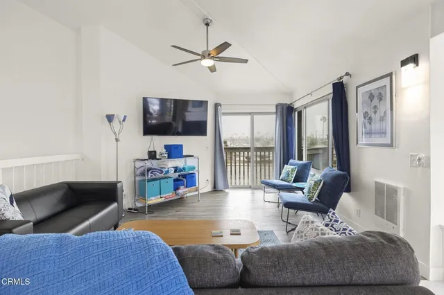 a view of swimming pool with outdoor seating and city view
