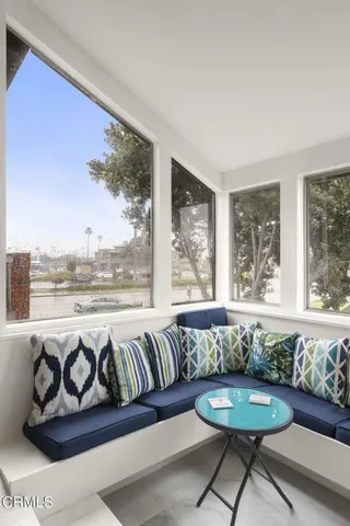 a view of a dining room with furniture window and outside view