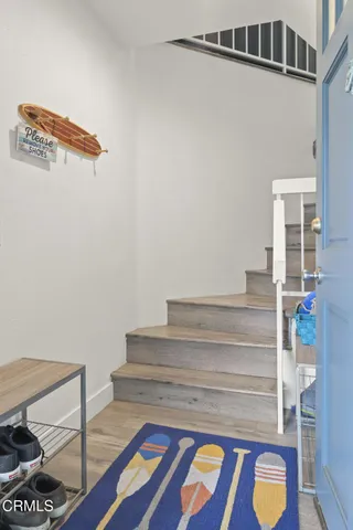 a view of a living room with furniture and a window