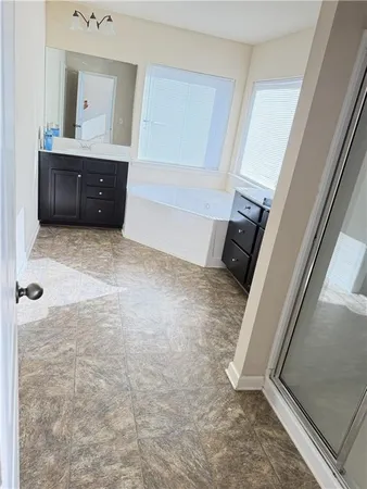 a bathroom with a sink and vanity