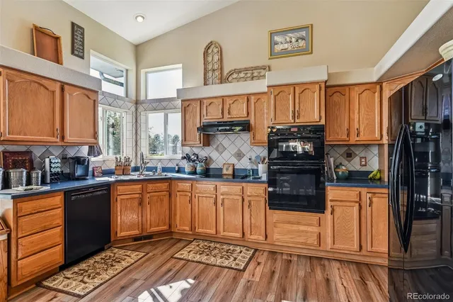 a bedroom with a bed and a flat tv screen