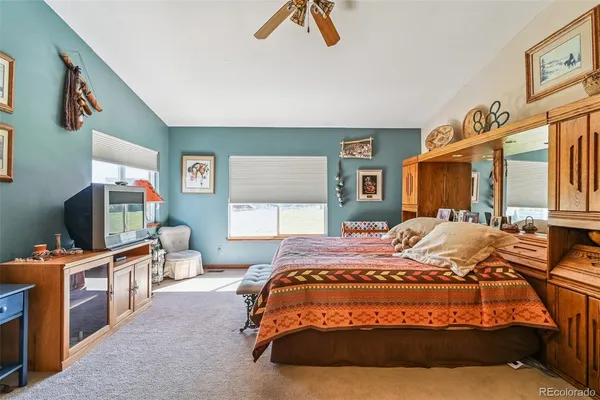 a bed room with a bed and dresser