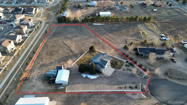 an aerial view of a house with a couch