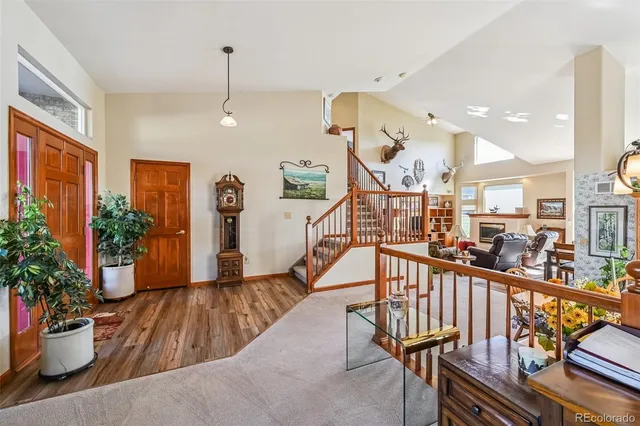 a view of a livingroom with workspace and a window